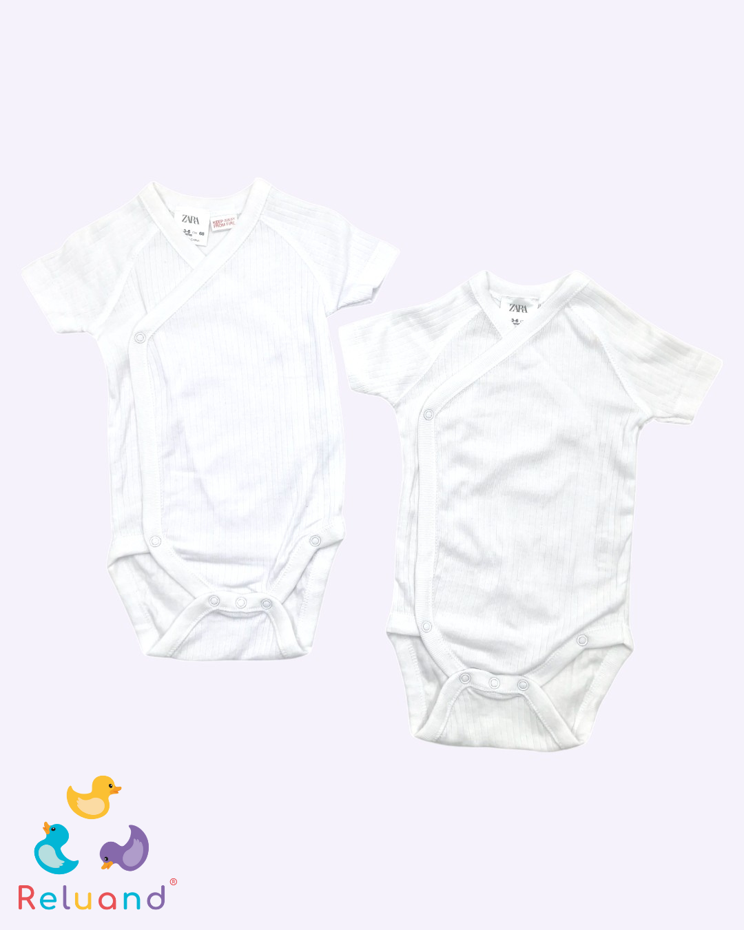 Body blanco con rayas, Marca Zara, Talla 3 a 6 meses.