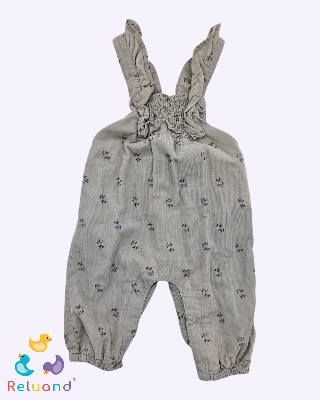 Jumper gris en tela símil pana con flores minimalistas en negro, mangas risadas, Talla 3 a 6 meses.