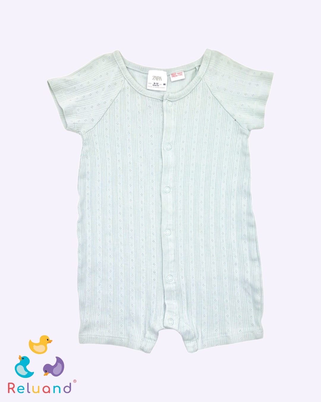 Jumper verde pistacho con grabados, Marca Zara, Talla 9 a 12 meses.