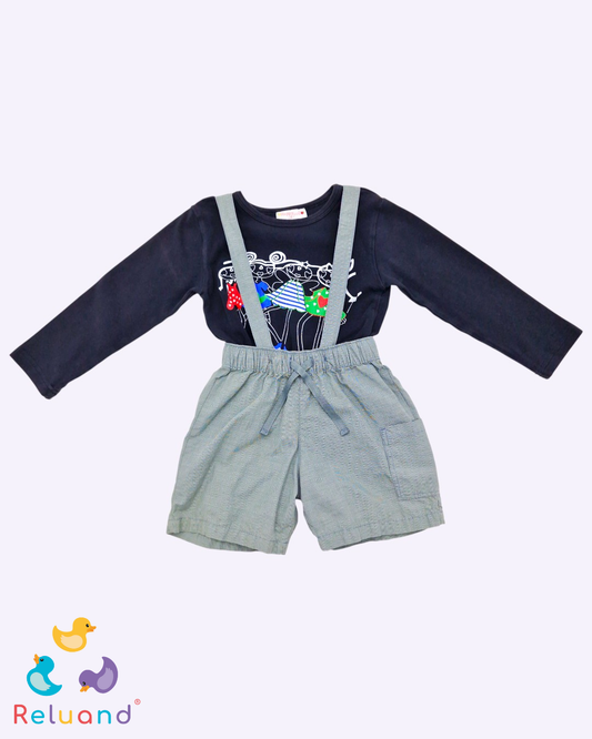 Conjunto de overol gris en short marca Polito y blusa en color negro con estampado de muñecas marca Happy, talla 24 meses.