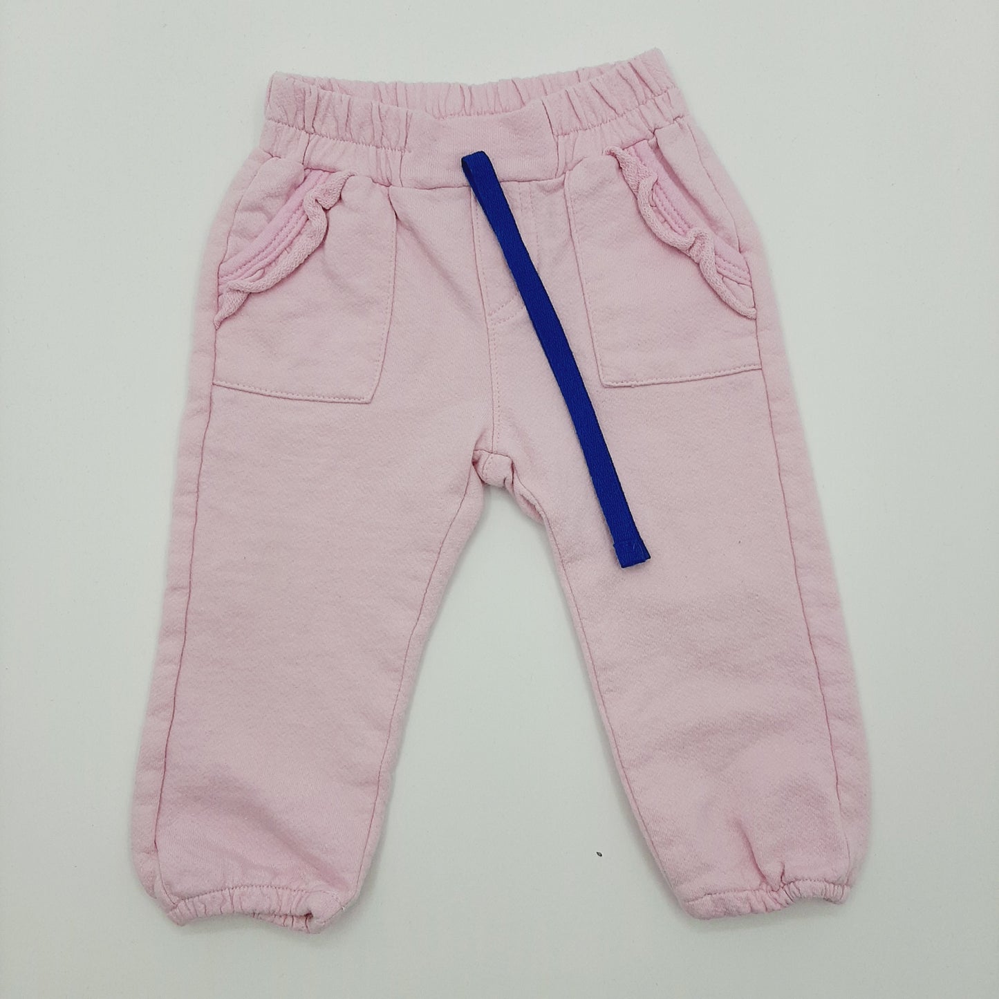 Pantalon rosado de bolsillos 12M