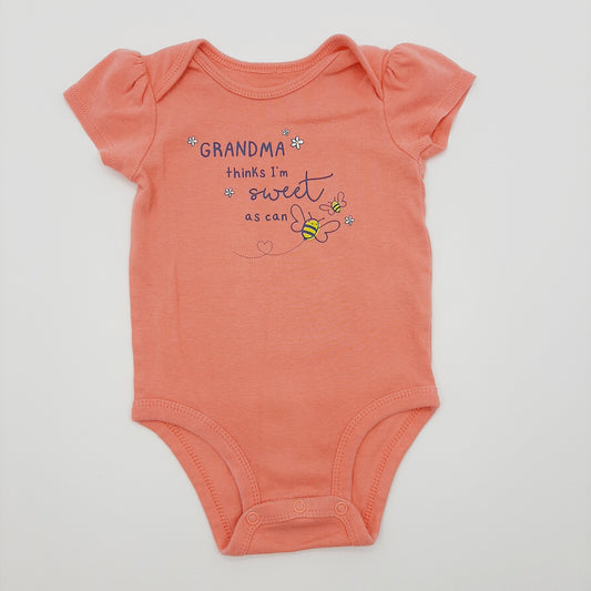 Body salmon de abejita 6M marca Carter´s