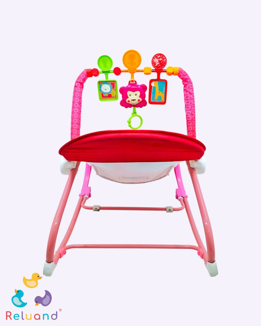 Silla vibradora/mecedora en color rosa con elefante en el arnes de ajuste.