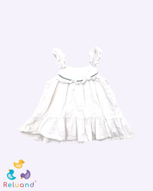 Blusa blanca con textura de pepas, maraca Cielito, talla 2T.