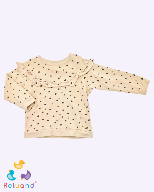 Blusa en color beige con corazones en negro, Marca H&M, Talla 12 meses.