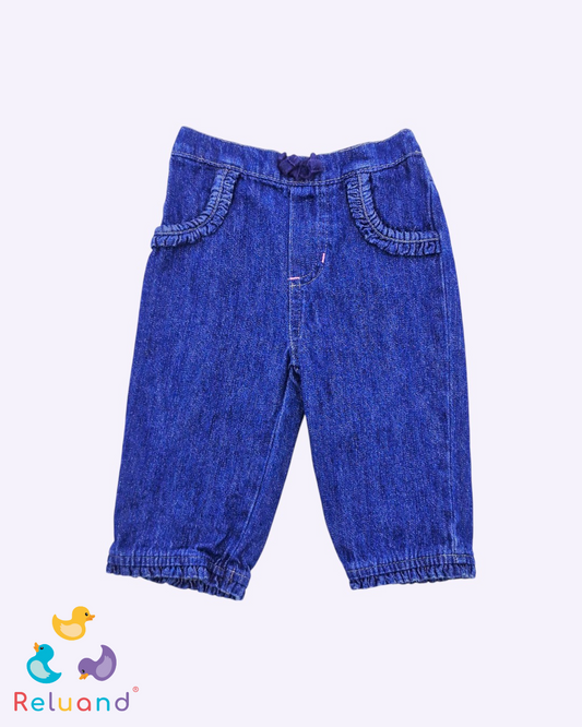 Jean con cortes rizados y moño azul en pretina, Marca Garanimals, Talla 6 a 9 meses.