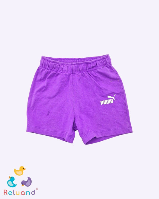 Short lila de marca Puma, talla 2T.