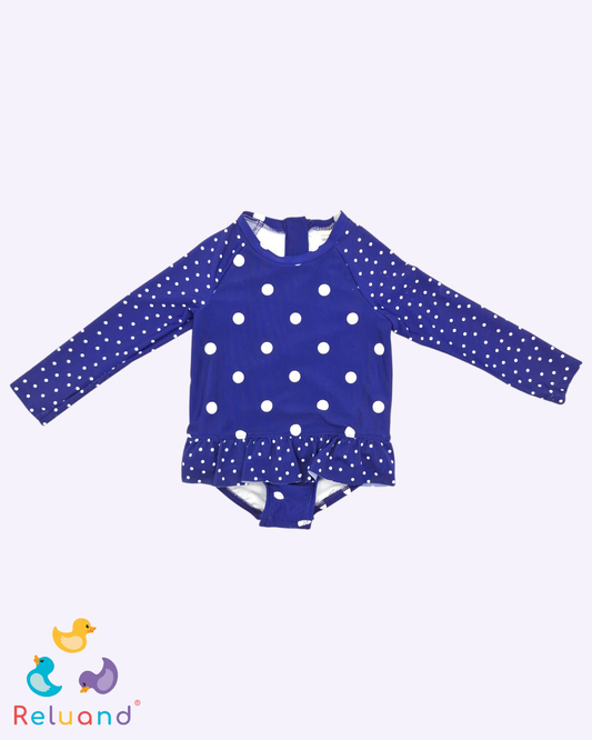 Vestido de baño enterizo manga larga en color azul oscuro con pepas blancas. Marca OshKosh B´gosh, talla 18 meses.