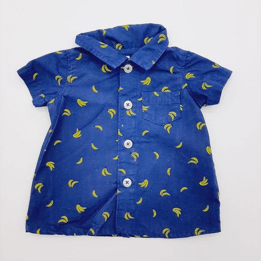 Camisa azul con bananos marca Carters