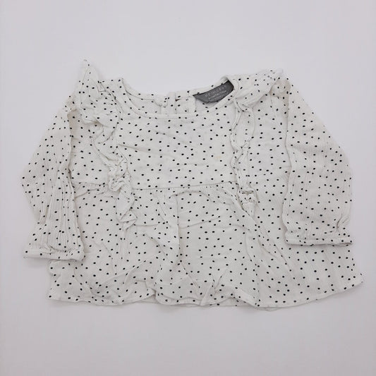 Blusa blanca de pepitas 6-9M marca Primark