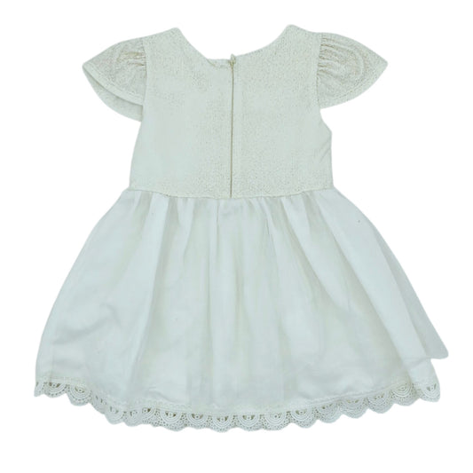 Vestido beige  con flor — Talla 24 a 36 meses | Usado